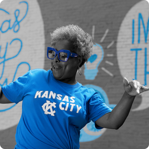 Happy woman with Kansas City shirt