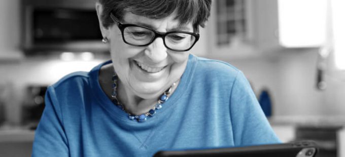woman using a computer and smiling